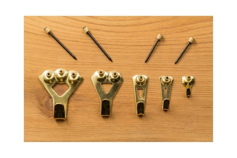 picture hooks are not best suited to drywall but the nails can be substituted for screws with a drywall anchor