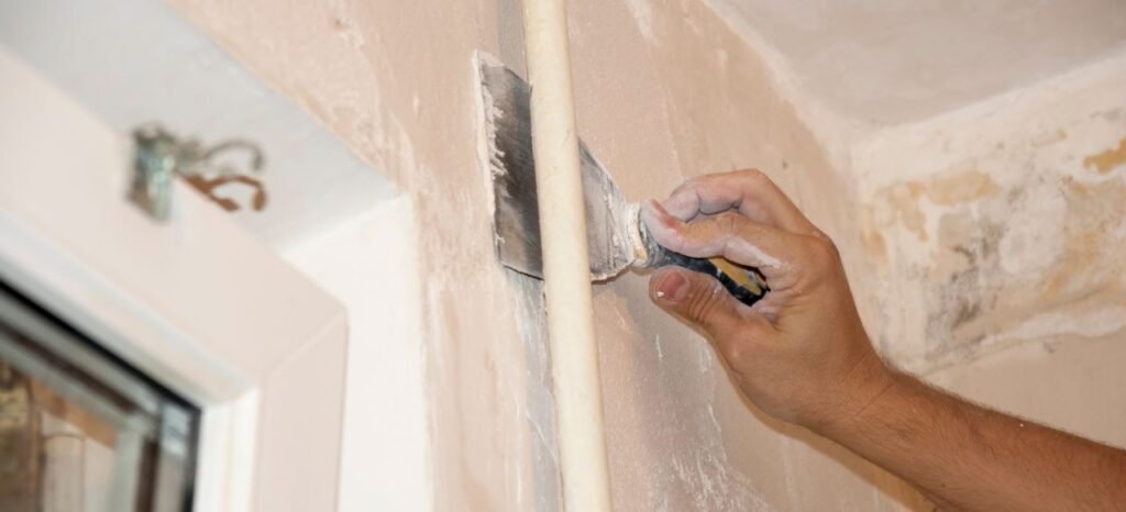 plastering and repairing old wall